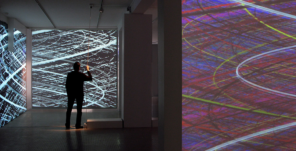 Irrational Geometrics, 2008 / Installation view, Galerie Municipale, Vitry-sur-Seine, FR / Interactive installation with 4 videoprojectors, 2 computers and custom software, each screen: 4 × 3 m (Video software: Claude Micheli, Electronic: Sylvain Belot)
