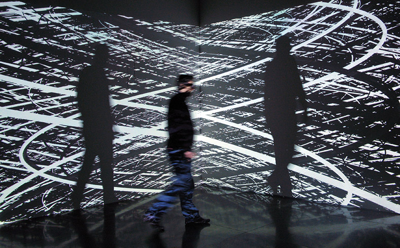 Irrational Geometrics, 2008  / Interactive installation with 4 videoprojectors, 2 computers and custom software, each screen: 4 × 3 m (Video software: Claude Micheli, Electronic: Sylvain Belot)