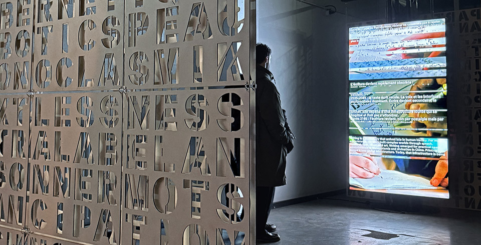 The End of Writing, 2026 / Exhibition view, L'Ososphere, Strasbourg, France, 2026 / Cut letter plates & algorithmically composed video installation on 3 screens / Video software : Claude Micheli